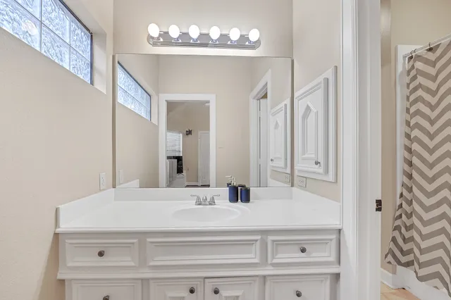 a bathroom with a sink and a mirror