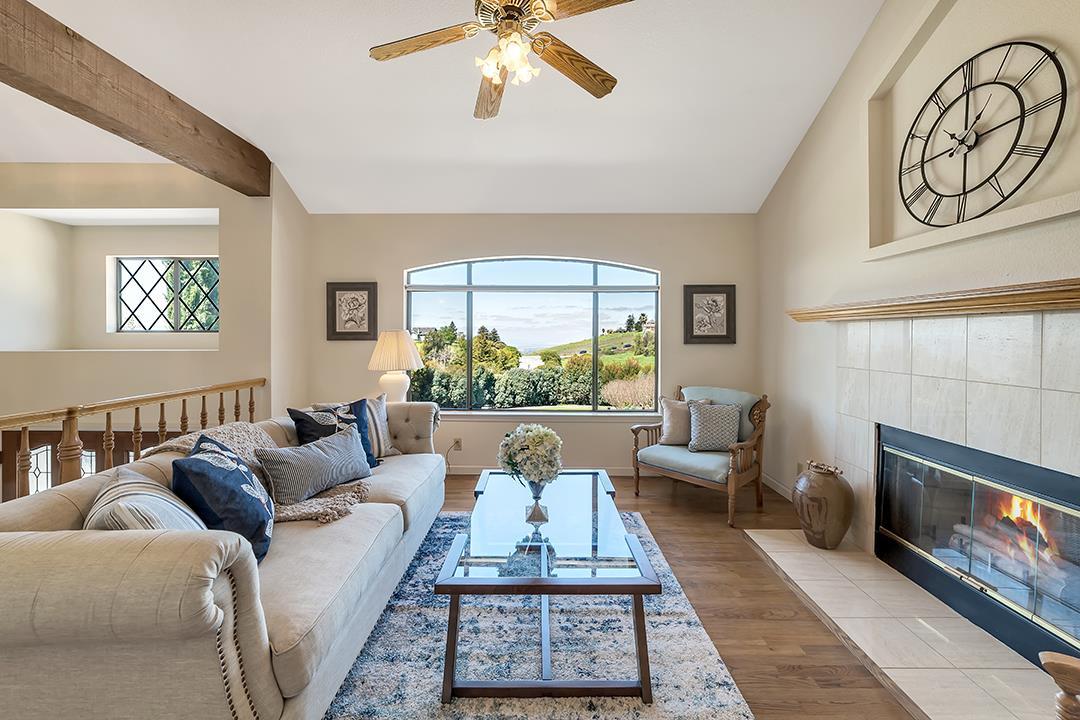 3130 Springview Lane San Jose, CA 95140 - Photo 3 of 47 a living room with furniture a fireplace and a large window