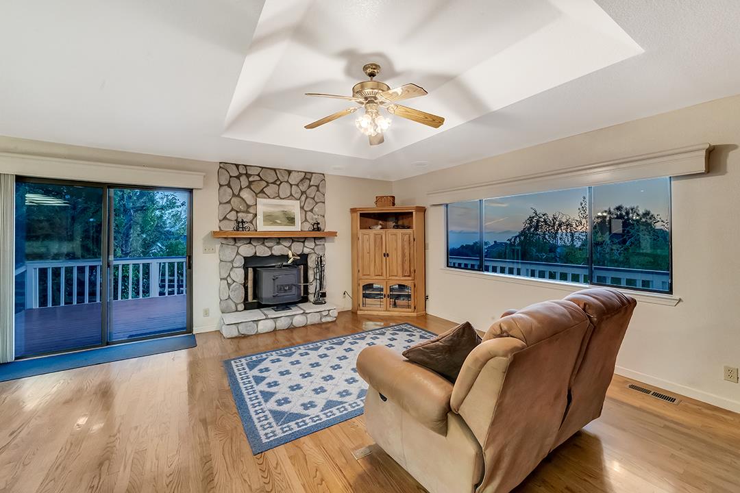 3130 Springview Lane San Jose, CA 95140 - Photo 23 of 47 a living room with furniture and a fireplace