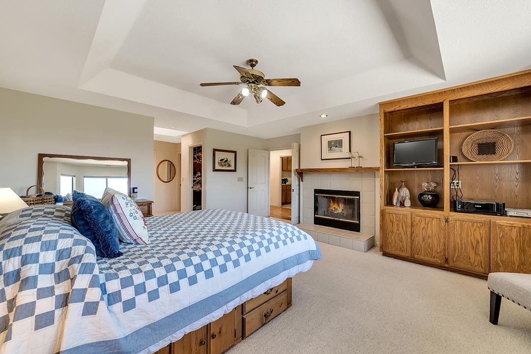 3130 Springview Lane San Jose, CA 95140 - Photo 25 of 47 a bedroom with a bed and a fireplace