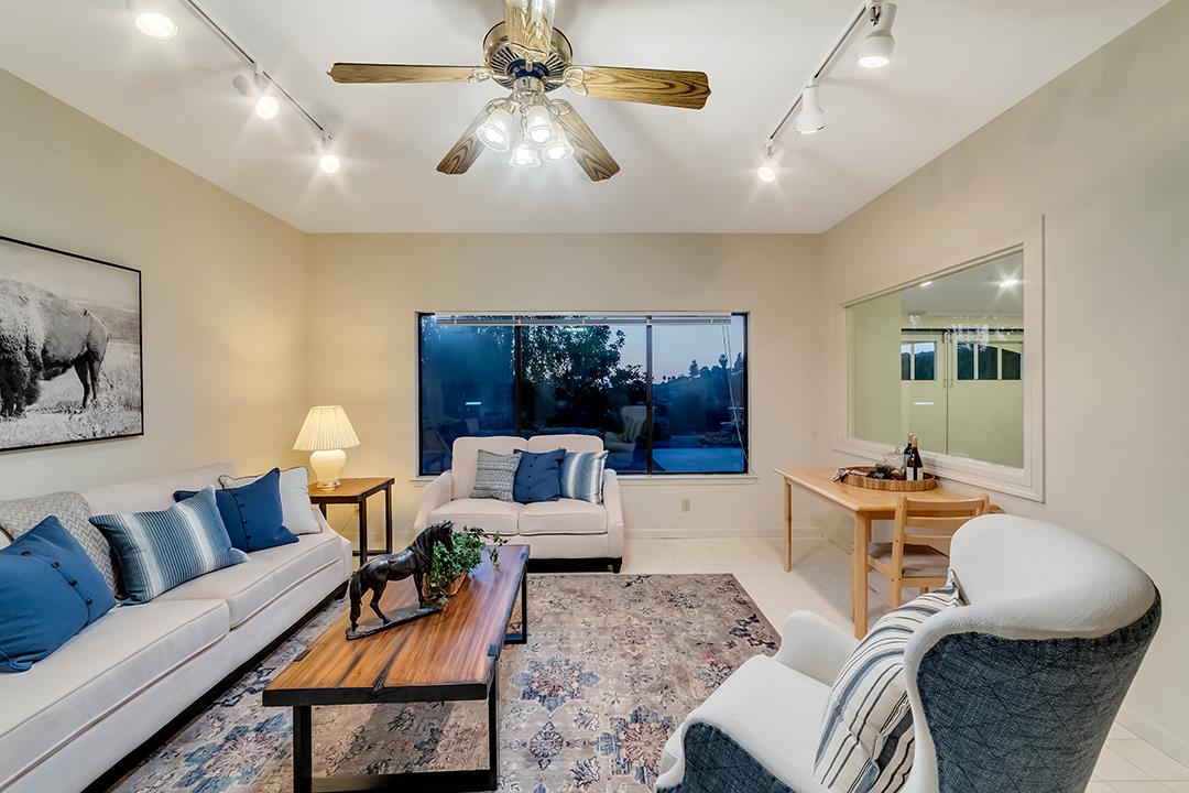 3130 Springview Lane San Jose, CA 95140 - Photo 26 of 47 a living room with furniture and a large window