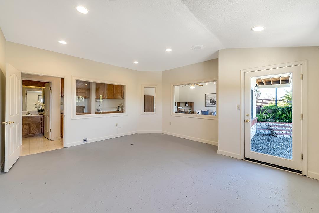 3130 Springview Lane San Jose, CA 95140 - Photo 27 of 47 an empty room with entrance and windows