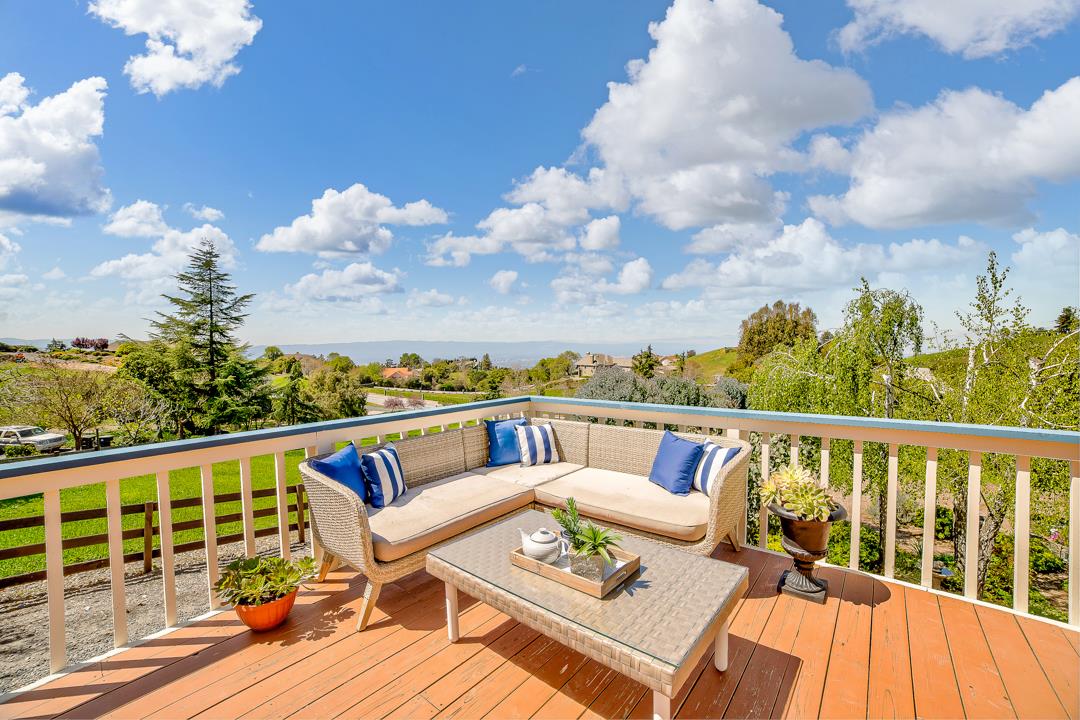 3130 Springview Lane San Jose, CA 95140 - Photo 30 of 47 a view of a balcony with mountain view and wooden floor