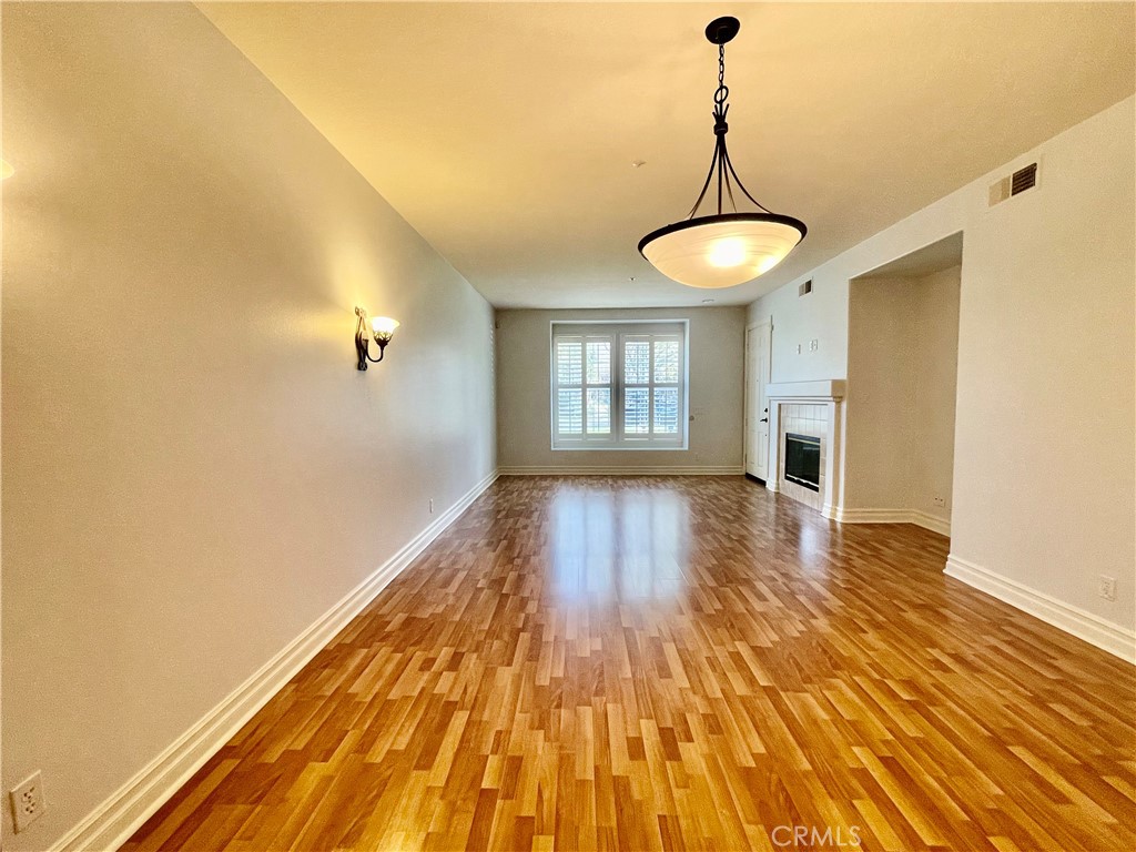 26 Cabazon Irvine, CA 92602 - Photo 2 of 9 a view of empty room with wooden floor and fan