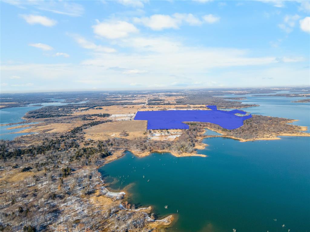 2465 Harpole Road Tioga, TX 76271 - Photo 13 of 14 a view of an ocean with beach