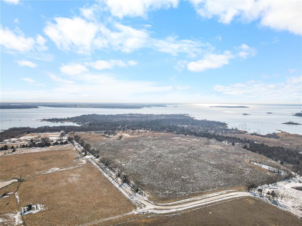 2465 Harpole Road Tioga, TX 76271 - Photo 5 of 14 a view of an ocean and beach