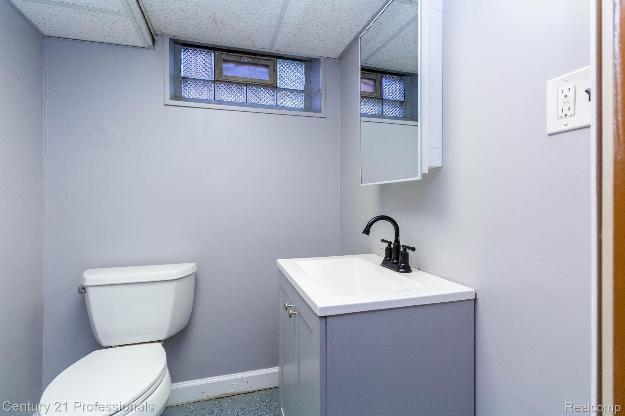 18951 Edinborough Road Detroit, MI 48219 - Photo 25 of 47 Bathroom featuring vanity and a paneled ceiling