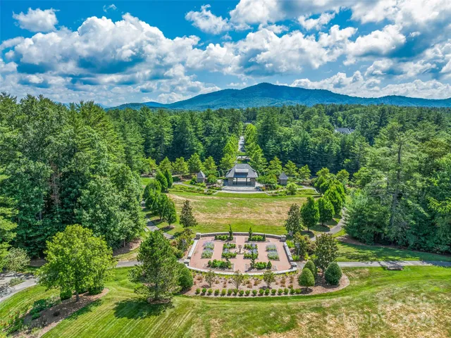 a view of a fountain in front of the house