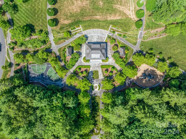 a aerial view of a house with a yard