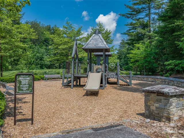 a view of a park with iron fence