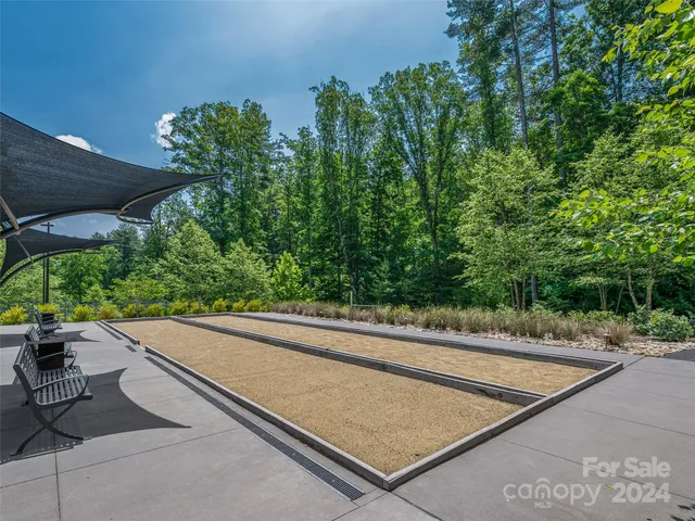 a view of a street with a sitting space
