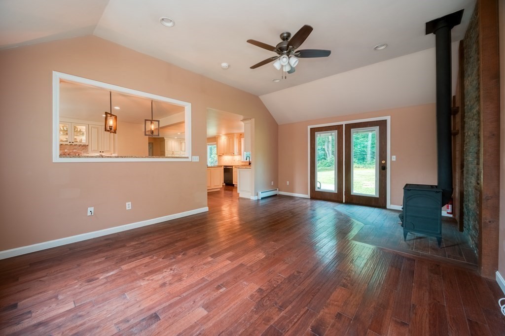 365 Turnpike Road Ashby, MA 01431 - Photo 12 of 37 a view of an empty room with wooden floor and a window