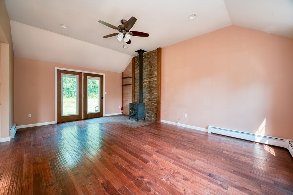 365 Turnpike Road Ashby, MA 01431 - Photo 13 of 37 a view of an empty room with wooden floor and a window