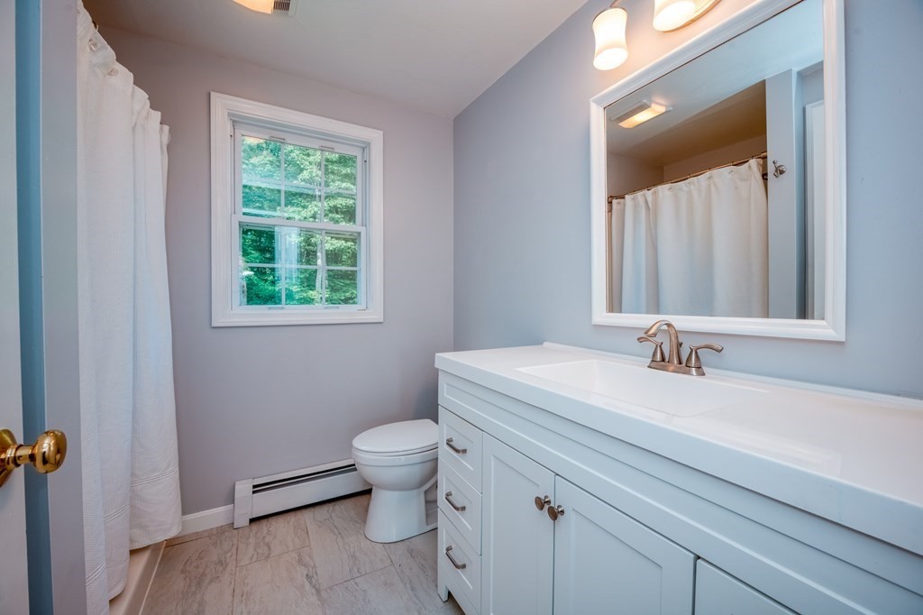 365 Turnpike Road Ashby, MA 01431 - Photo 23 of 37 a bathroom with a sink and a mirror