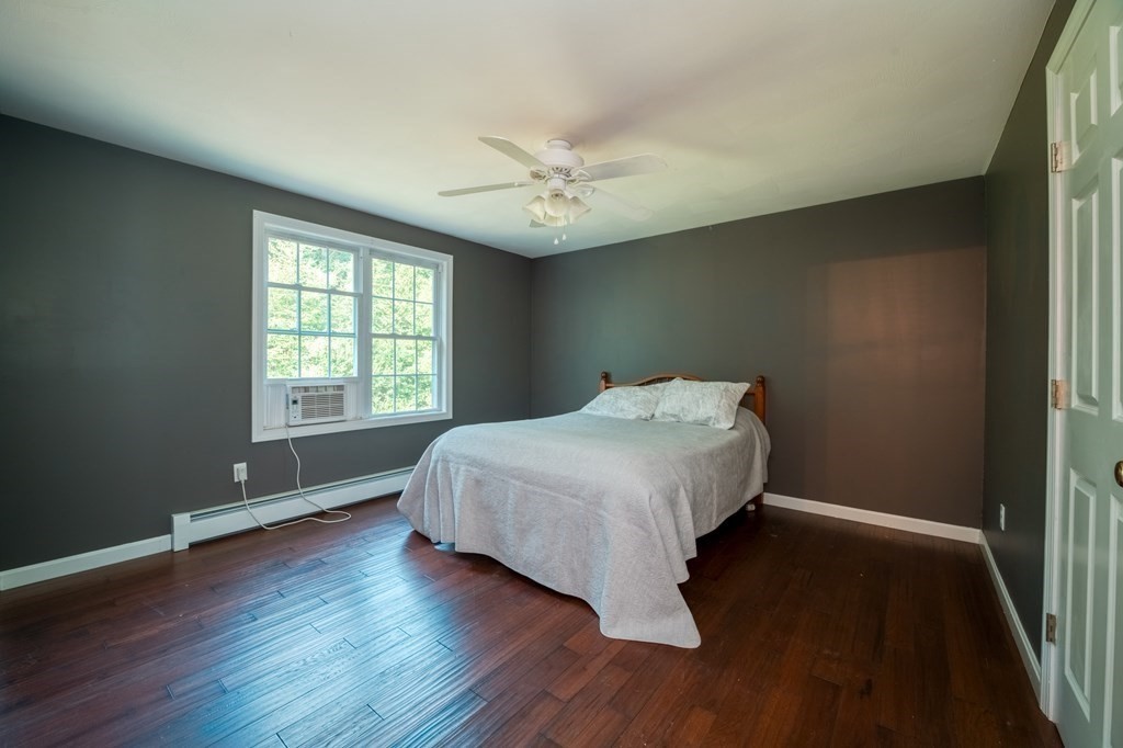 365 Turnpike Road Ashby, MA 01431 - Photo 24 of 37 an empty room with wooden floor and windows