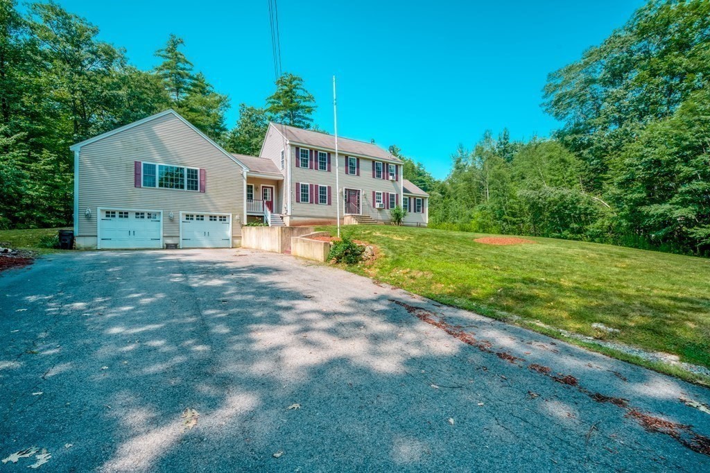 365 Turnpike Road Ashby, MA 01431 - Photo 29 of 37 a front view of a house with a yard