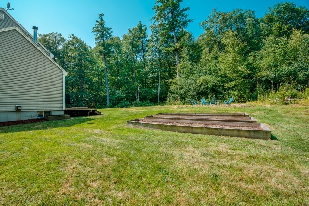 365 Turnpike Road Ashby, MA 01431 - Photo 30 of 37 a backyard of a house with lots of green space