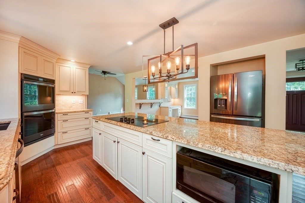 365 Turnpike Road Ashby, MA 01431 - Photo 6 of 37 a kitchen with a sink stove and microwave