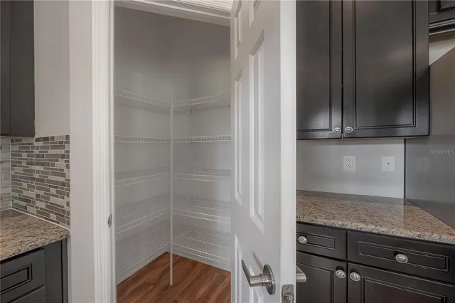 a kitchen with granite countertop a sink and a window