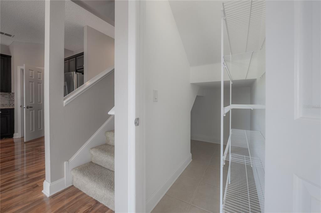 2012 Fern Ridge Court Holiday, FL 34691 - Photo 16 of 54 a view of staircase with wooden floor and staircase