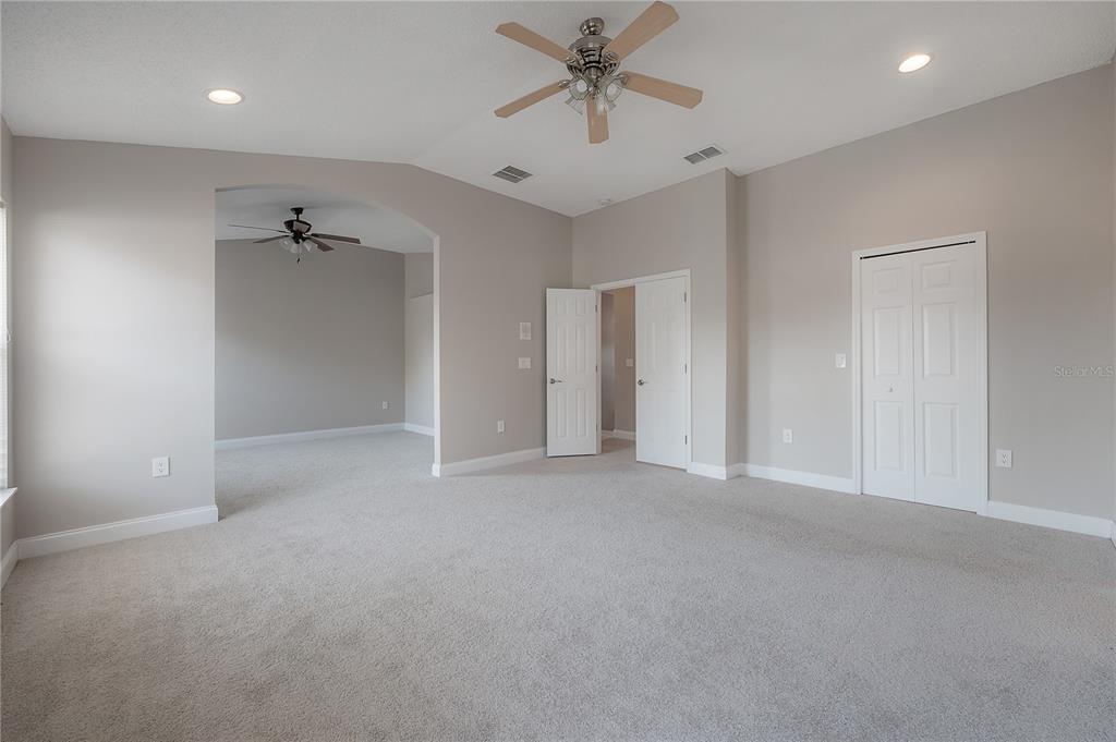 2012 Fern Ridge Court Holiday, FL 34691 - Photo 20 of 54 a view of a livingroom with a ceiling fan & entryway
