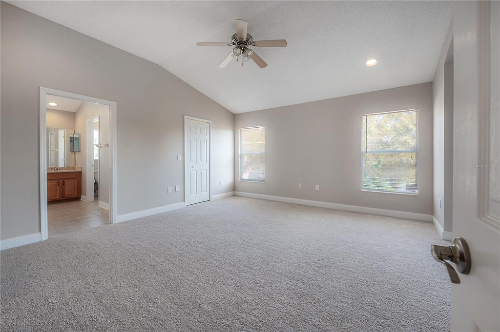 2012 Fern Ridge Court Holiday, FL 34691 - Photo 21 of 54 an empty room with windows and fan