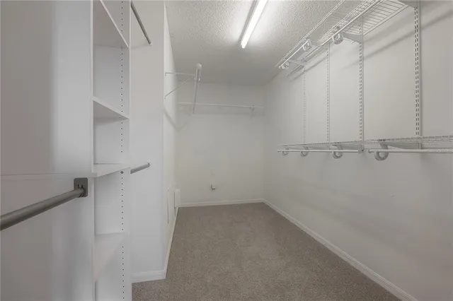 a spacious bathroom with a bathtub and a shower