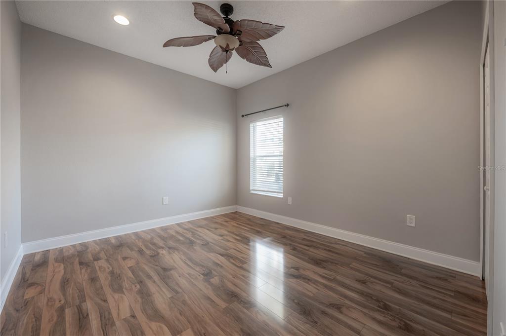 2012 Fern Ridge Court Holiday, FL 34691 - Photo 31 of 54 a view of empty room with wooden floor and fan