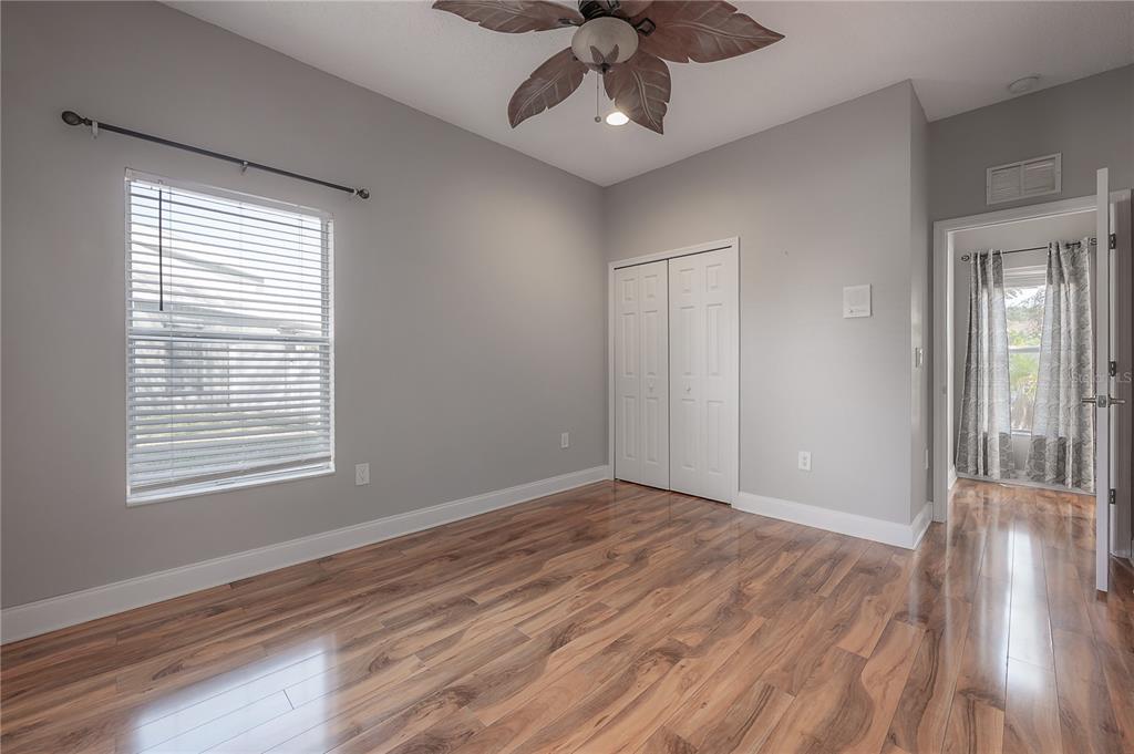 2012 Fern Ridge Court Holiday, FL 34691 - Photo 32 of 54 a view of an empty room with wooden floor and a window