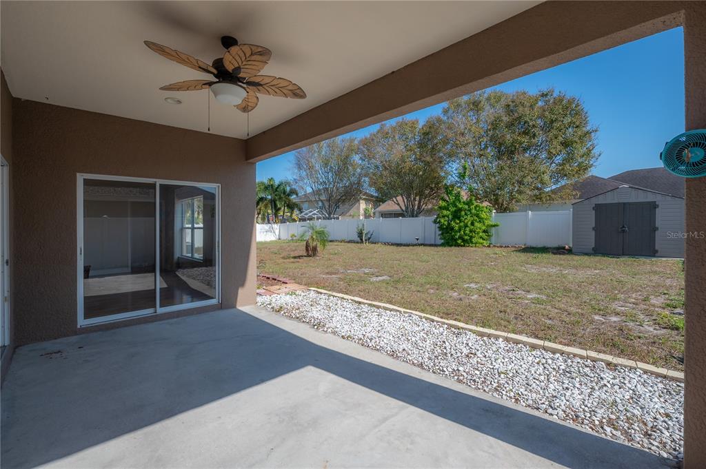 2012 Fern Ridge Court Holiday, FL 34691 - Photo 38 of 54 a view of a livingroom with a ceiling fan and window