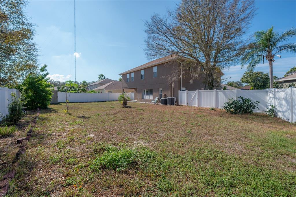 2012 Fern Ridge Court Holiday, FL 34691 - Photo 41 of 54 a house view with a outdoor space