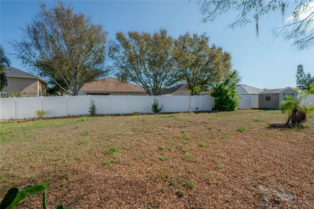 2012 Fern Ridge Court Holiday, FL 34691 - Photo 42 of 54 a front view of house with yard and trees