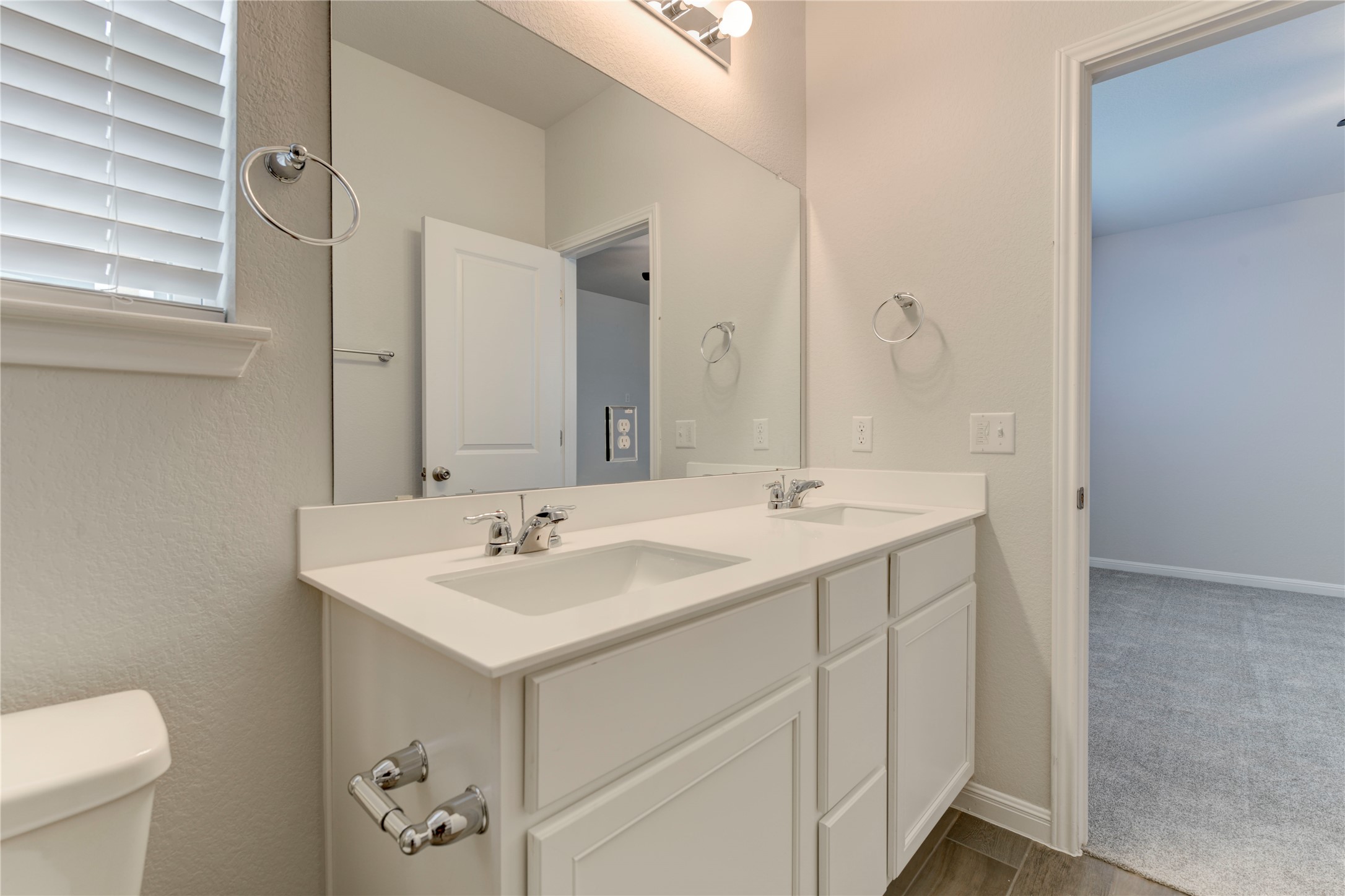 10716 Timber Brook Pass Austin, TX 78747 - Photo 14 of 33 a bathroom with a sink and a toilet