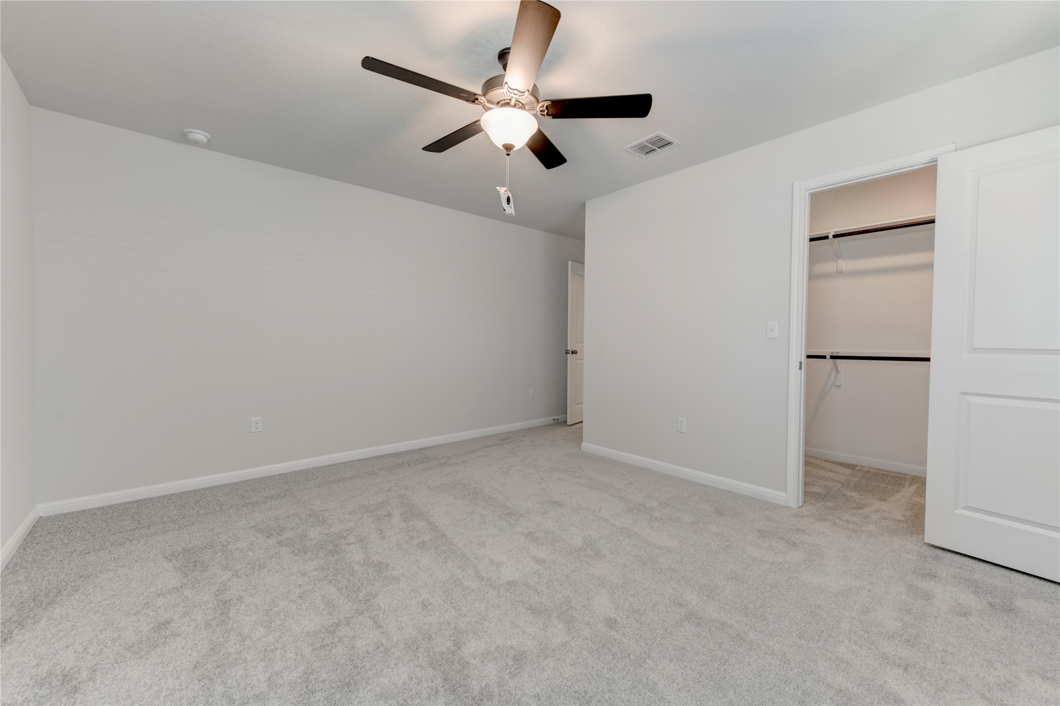 10716 Timber Brook Pass Austin, TX 78747 - Photo 22 of 33 an empty room with closet and ceiling fan