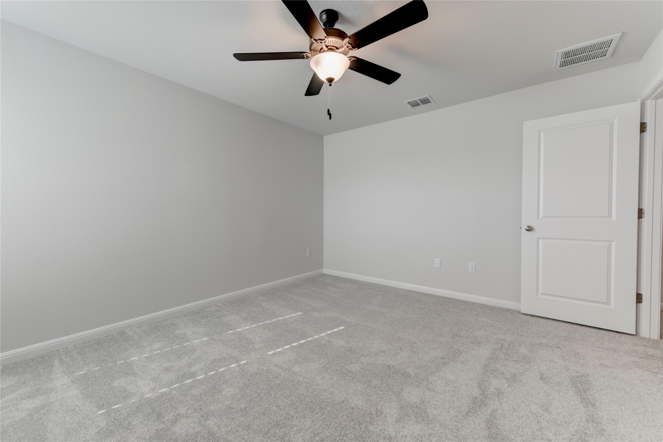 10716 Timber Brook Pass Austin, TX 78747 - Photo 30 of 33 an empty room with a ceiling fan and a fan