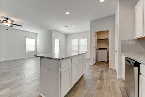 a view of a kitchen with a sink and a window