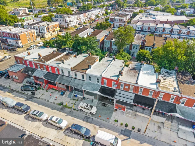 an aerial view of a houses with outdoor space