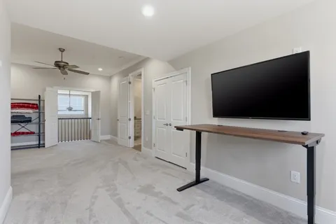 a view of a livingroom with a flat screen tv