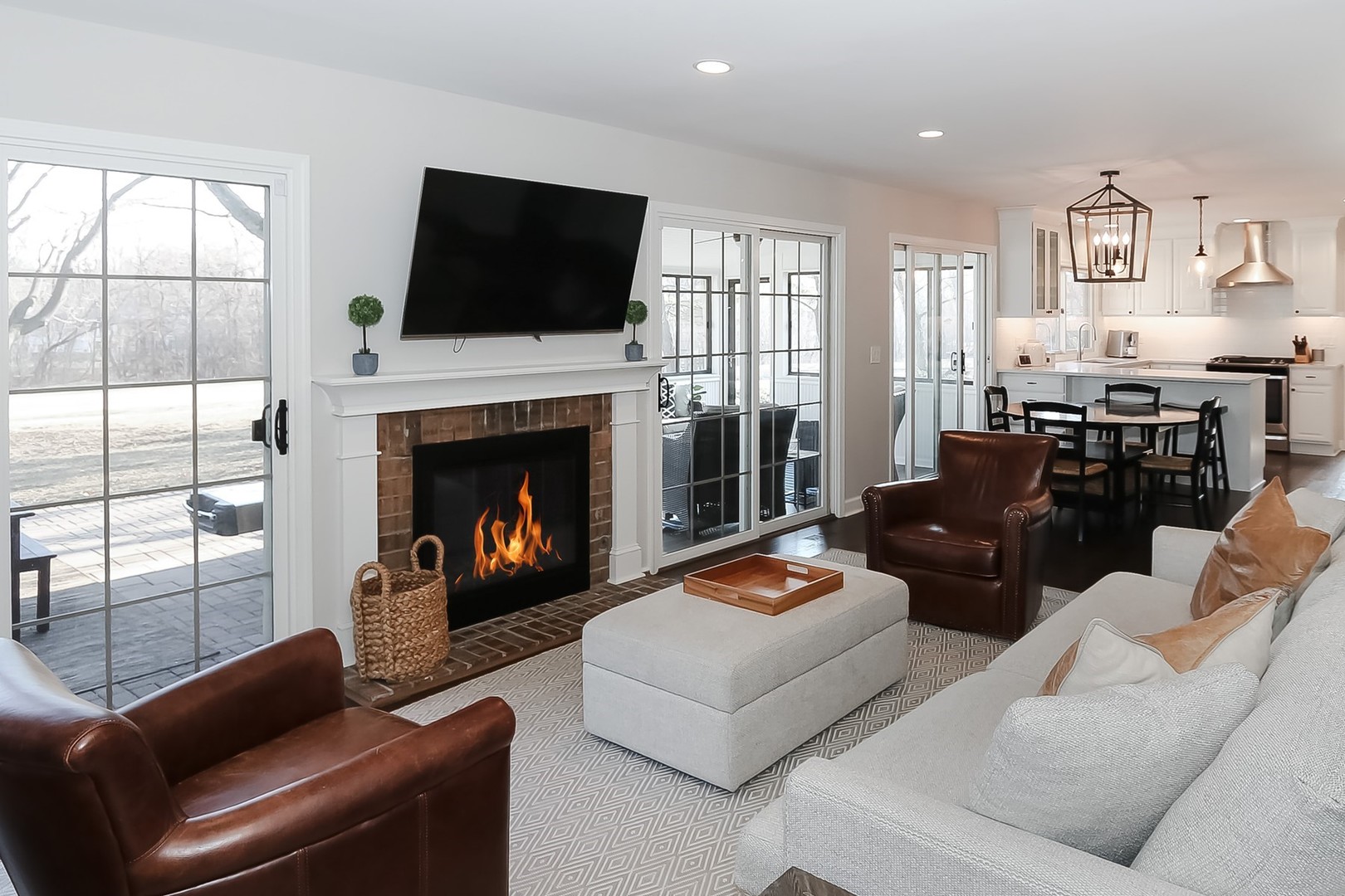 879 Georgetowne Lane Barrington, IL 60010 - Photo 14 of 44 a living room with furniture a flat screen tv and a fireplace