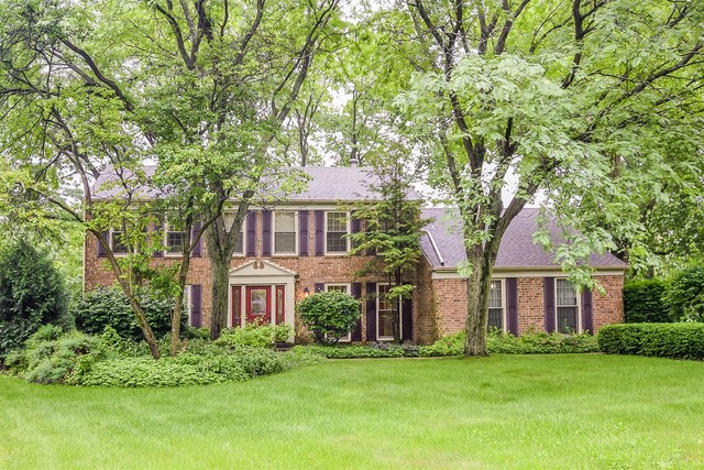 879 Georgetowne Lane Barrington, IL 60010 - Photo 23 of 44 a front view of a house with a garden