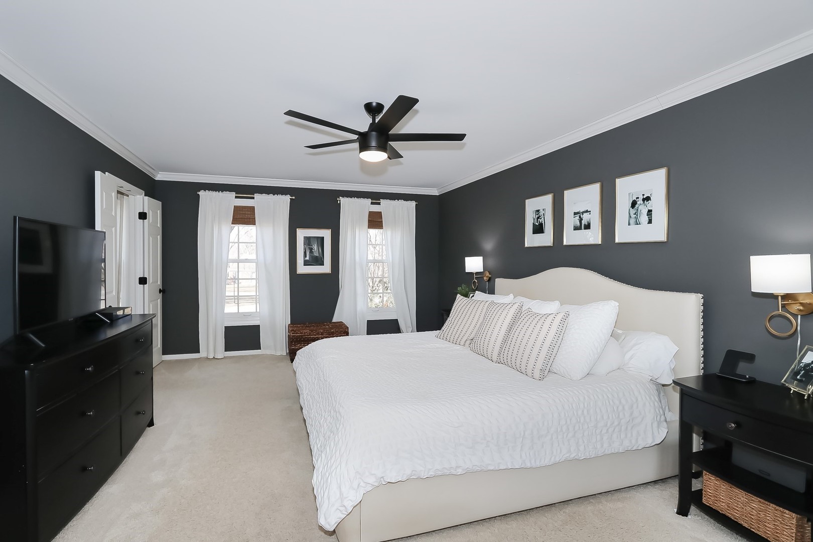 879 Georgetowne Lane Barrington, IL 60010 - Photo 25 of 44 a bedroom with a bed and a flat screen tv