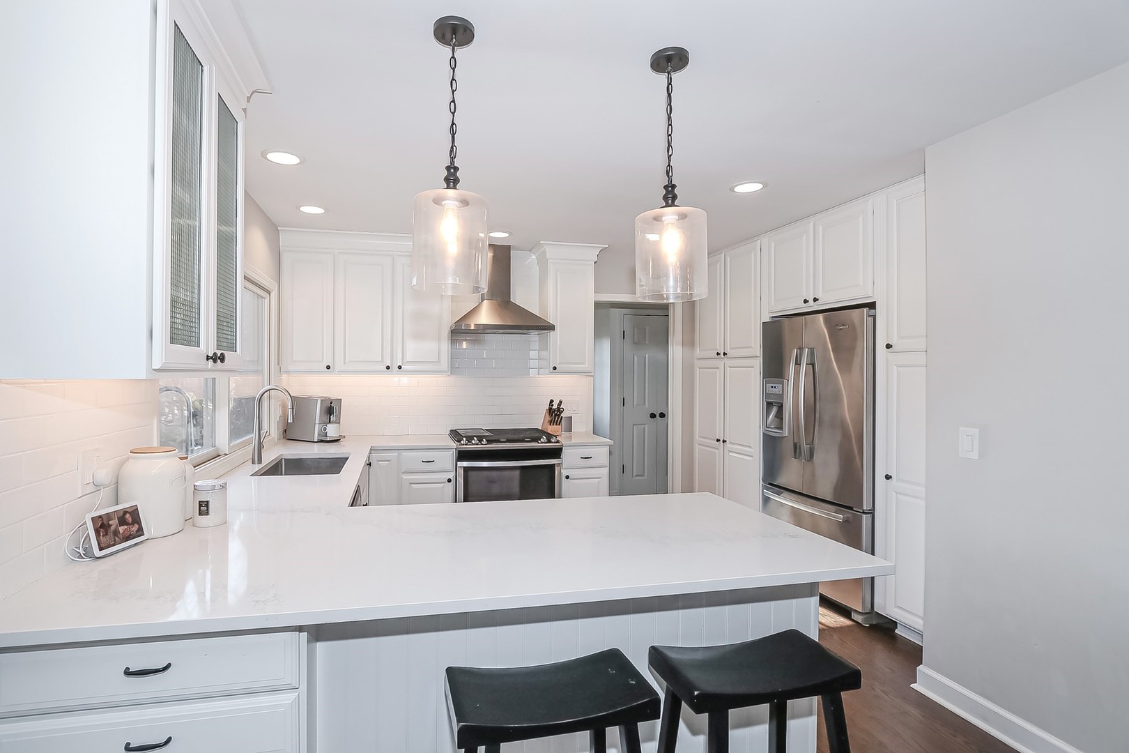 879 Georgetowne Lane Barrington, IL 60010 - Photo 4 of 44 a kitchen with stainless steel appliances a sink a stove a refrigerator and cabinets