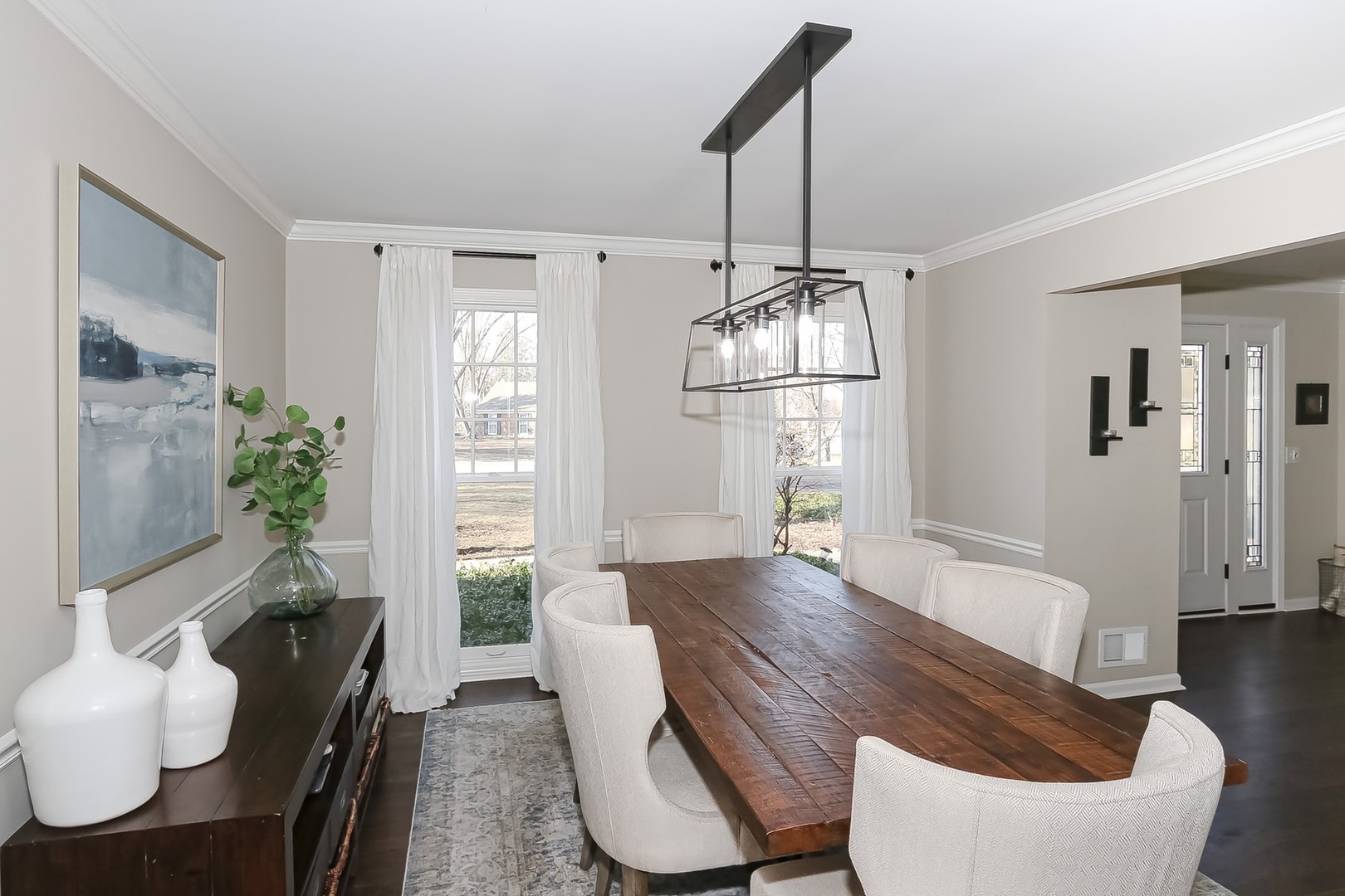 879 Georgetowne Lane Barrington, IL 60010 - Photo 8 of 44 a view of a dining room with furniture window and wooden floor