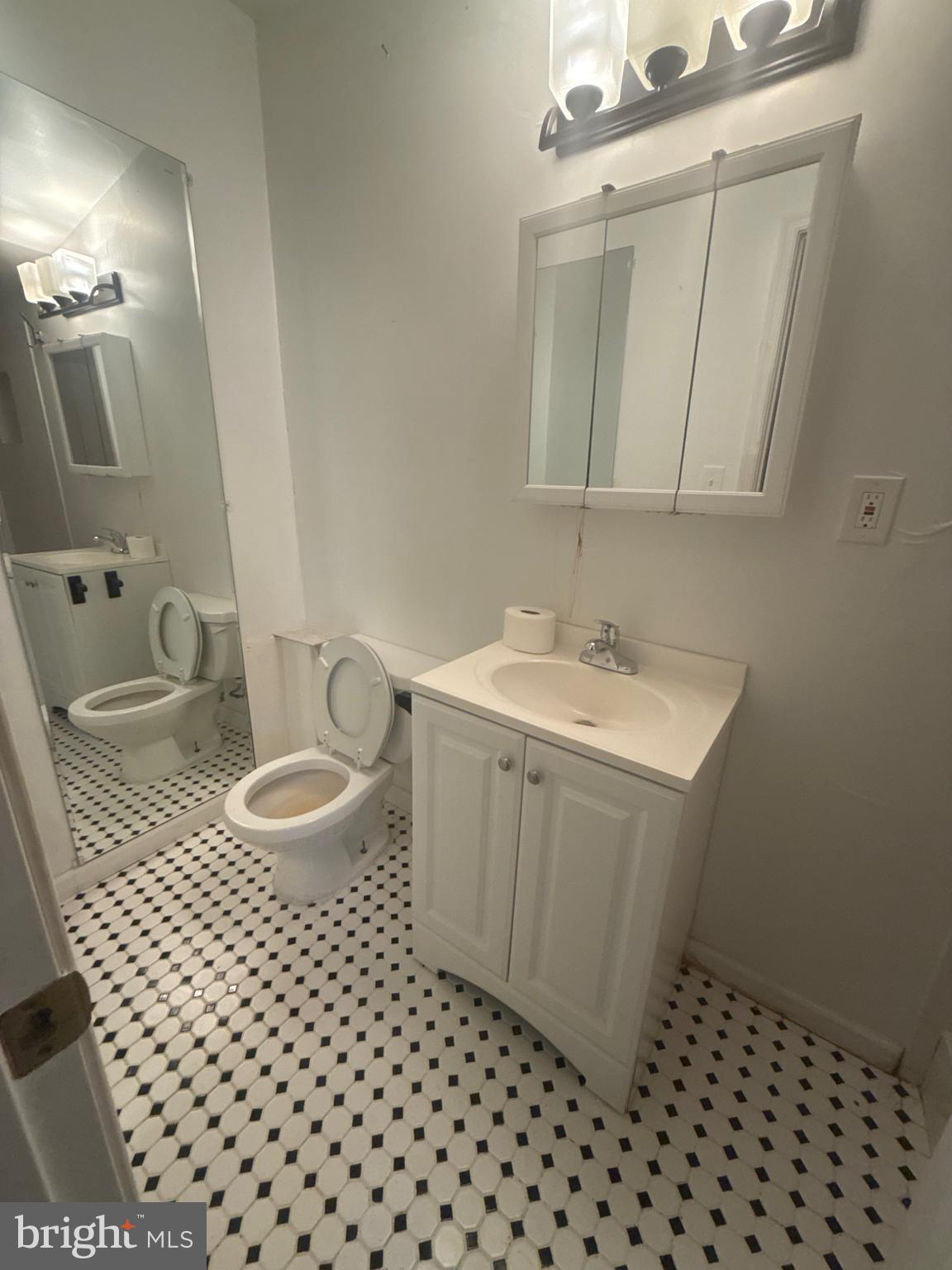 622 11th Street Northeast Washington, DC 20002 - Photo 13 of 15 a bathroom with a sink and a mirror