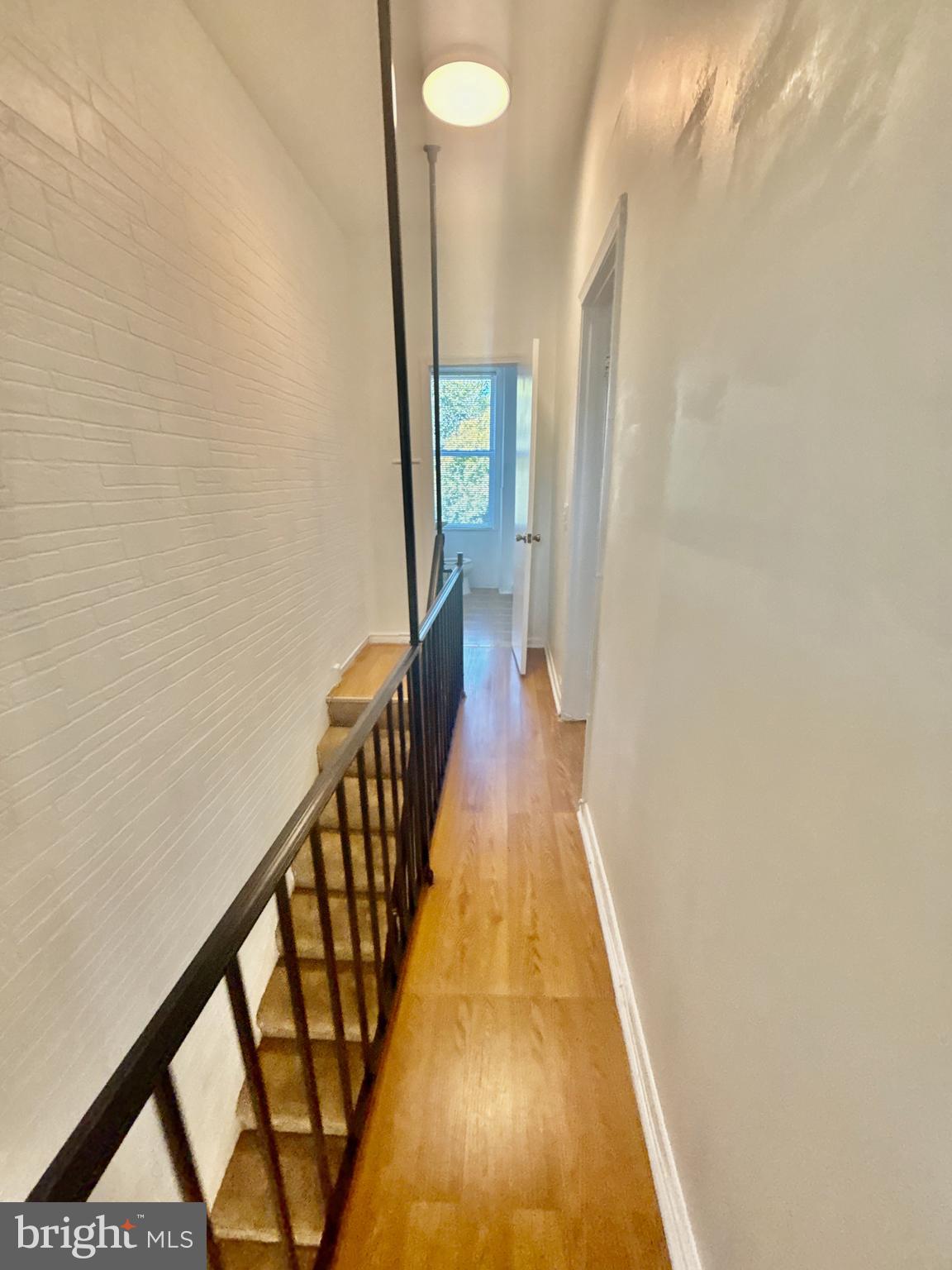 622 11th Street Northeast Washington, DC 20002 - Photo 7 of 15 a view of a hallway with wooden floor and staircase