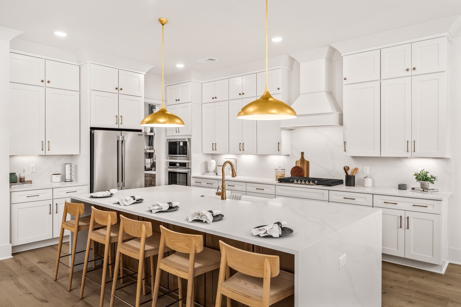 5009 Fairhaven Circle Franklin, TN 37064 - Photo 2 of 11 a kitchen with stainless steel appliances kitchen island a table chairs sink and cabinets