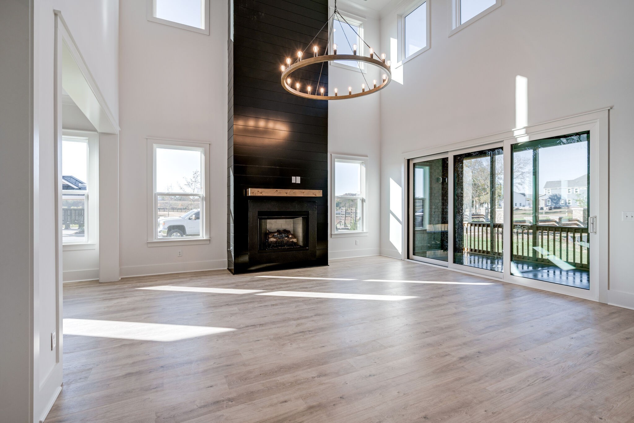 5009 Fairhaven Circle Franklin, TN 37064 - Photo 4 of 11 a view of an empty room with wooden floor fireplace and a window