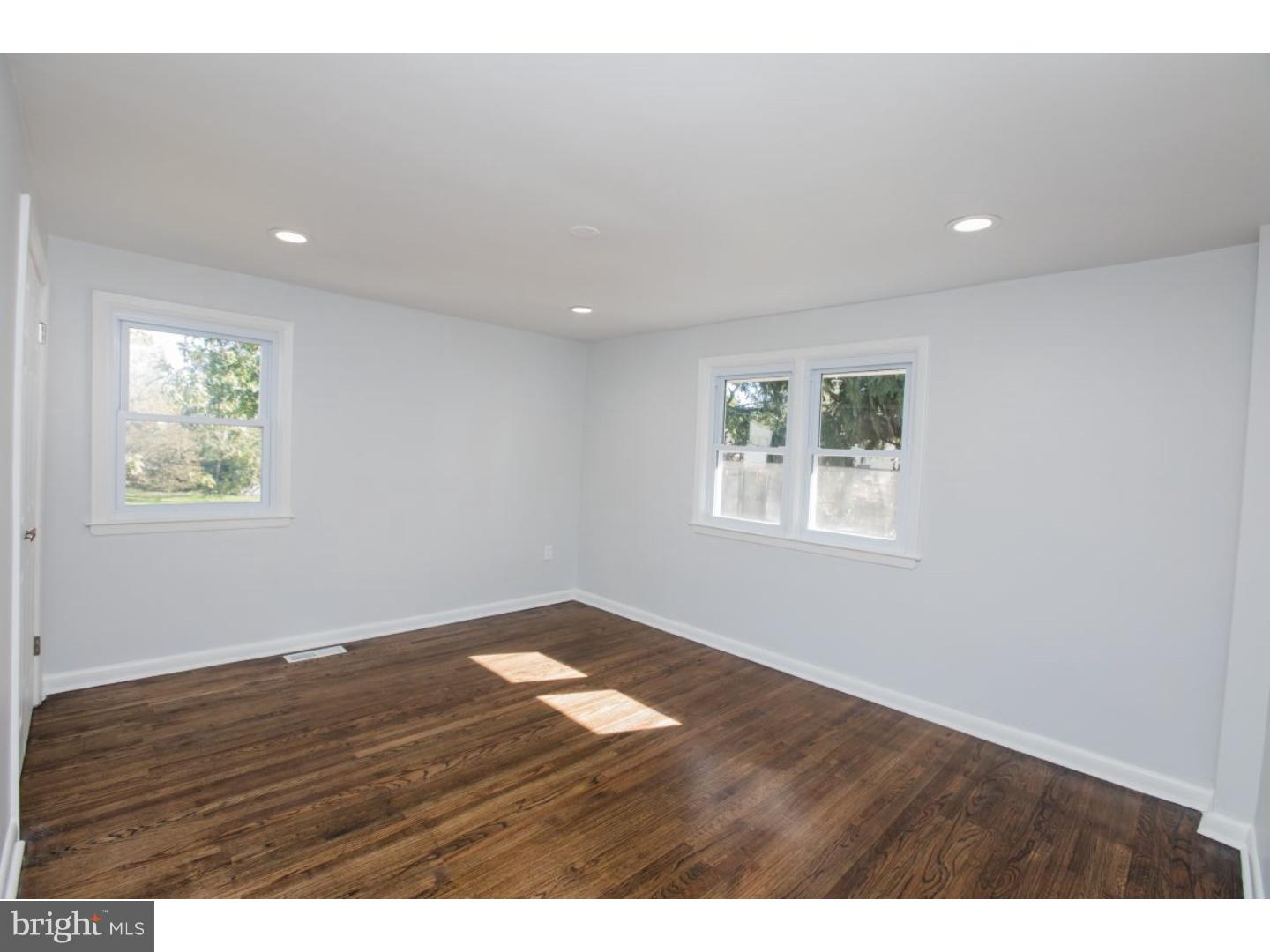 810 Coppock Lane Springfield, PA 19064 - Photo 13 of 24 a view of an empty room with wooden floor and a window
