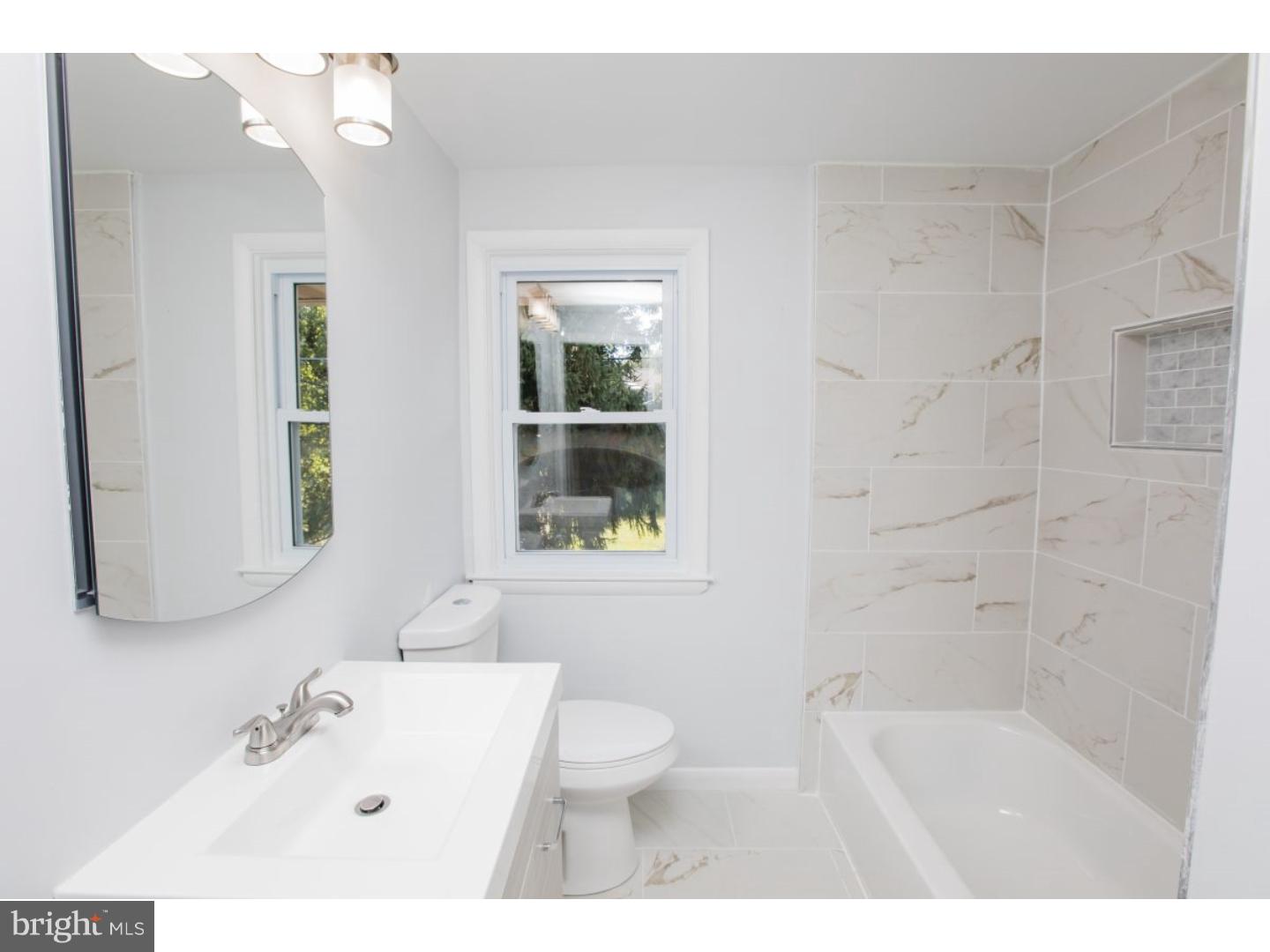 810 Coppock Lane Springfield, PA 19064 - Photo 14 of 24 a bathroom with a sink a toilet and shower