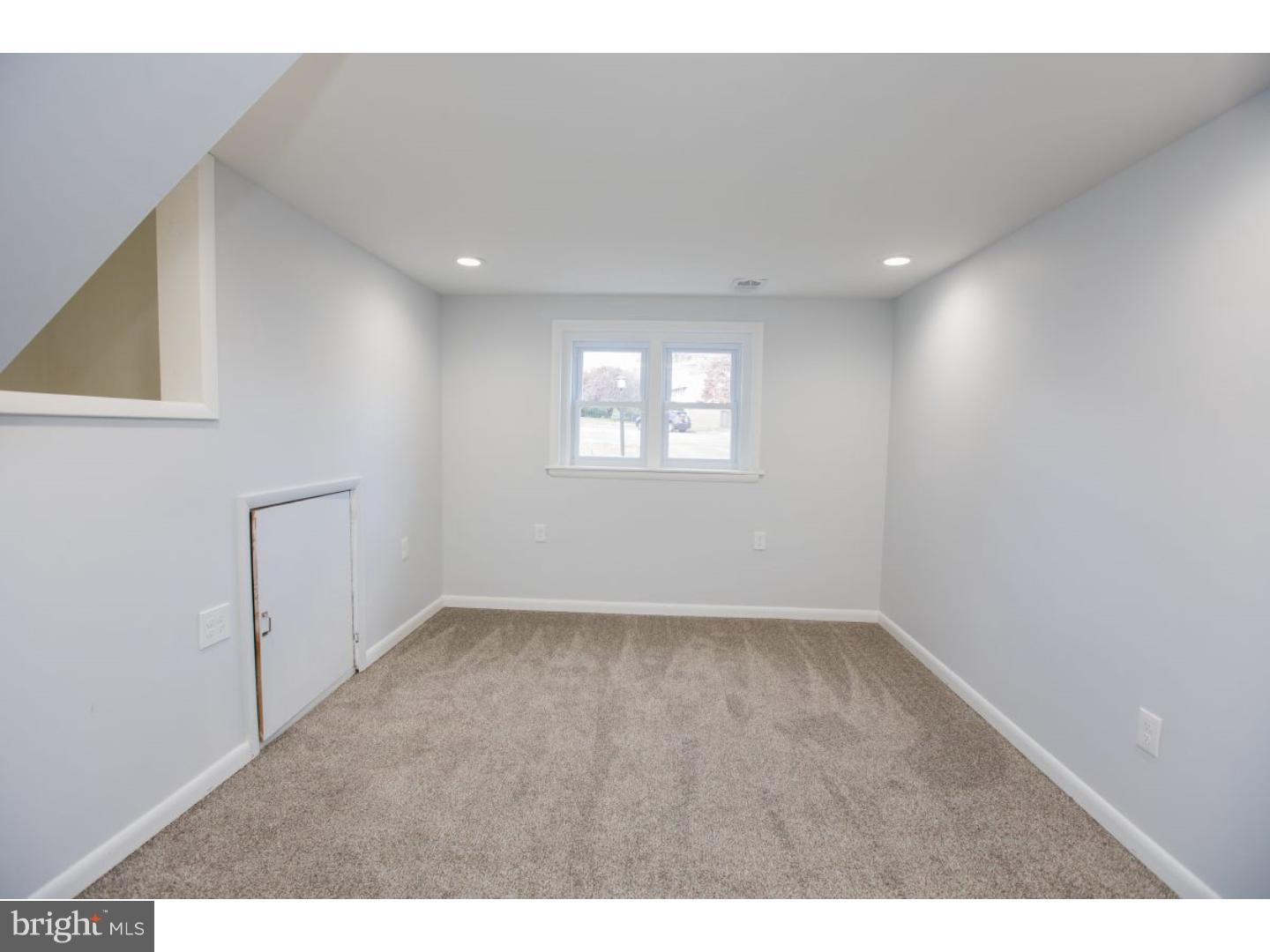 810 Coppock Lane Springfield, PA 19064 - Photo 18 of 24 a view of an empty room with a window
